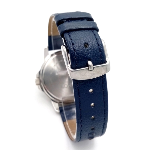 1053 - A Gents Sports Lorus Watch. Blue leather strap. Stainless steel case - 38mm. Blue dial with day/date... 