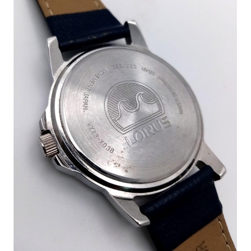 1053 - A Gents Sports Lorus Watch. Blue leather strap. Stainless steel case - 38mm. Blue dial with day/date... 