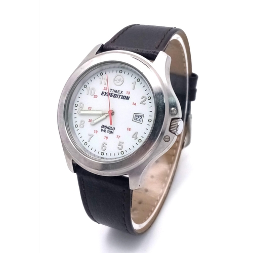 1060 - A Timex Expedition Indiglo Watch. Brown leather strap. Stainless steel case - 39mm. White dial with ... 