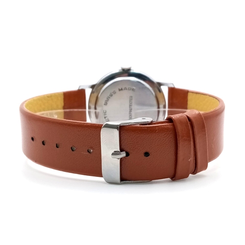 621 - A Vintage Newmark Gents Watch. Brown leather strap. Stainless steel case - 33mm. Textured white dial... 