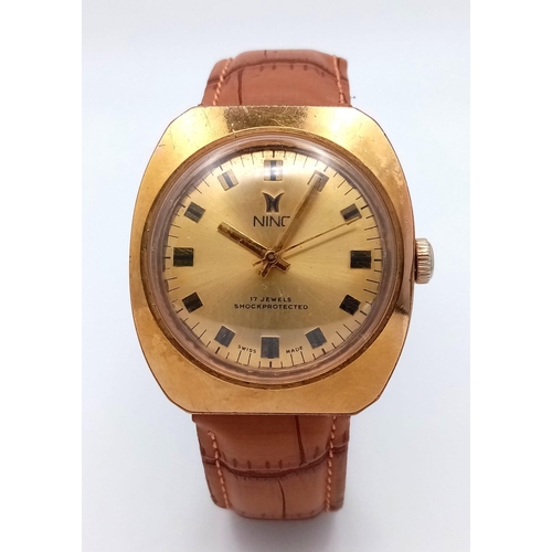 628 - A Vintage Nino 17 Jewel Automatic Gents Watch. Brown leather strap. Gilded case - 36mm. Gold tone di... 