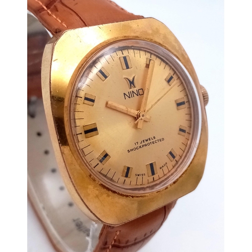 628 - A Vintage Nino 17 Jewel Automatic Gents Watch. Brown leather strap. Gilded case - 36mm. Gold tone di... 