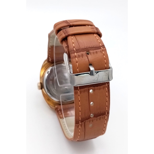 628 - A Vintage Nino 17 Jewel Automatic Gents Watch. Brown leather strap. Gilded case - 36mm. Gold tone di... 