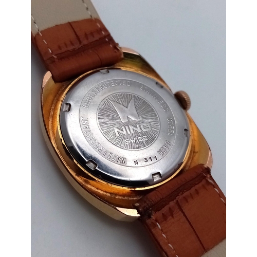 628 - A Vintage Nino 17 Jewel Automatic Gents Watch. Brown leather strap. Gilded case - 36mm. Gold tone di... 