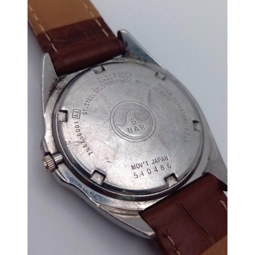 783 - A Seiko Quartz SQ 50 Quartz Watch. Brown leather strap. Two tine stainless steel case - 38mm. White ... 