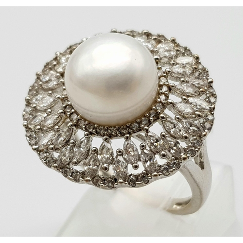 971 - Art Deco Design Silver Pearl & Clear Stone Set Ring Size O. Crown measures 2.1cm Diameter. Gross Wei... 