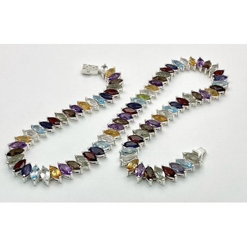 676 - An Electrifying Marquise Cut Multi-Colour Gemstone Necklace: Amethyst, Citrine, Garnet, and Aquamari... 