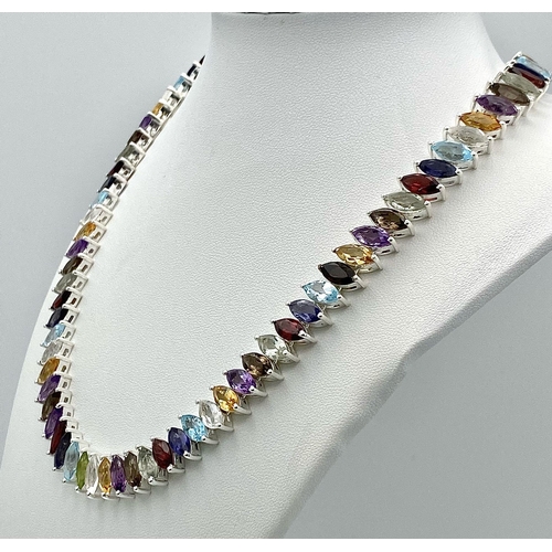 676 - An Electrifying Marquise Cut Multi-Colour Gemstone Necklace: Amethyst, Citrine, Garnet, and Aquamari... 