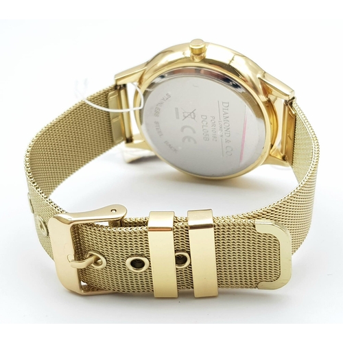 909 - An Unworn, Diamond & Co. London, Gold Tone Quartz Watch, Set with a Real Diamond on the Face at 12 O... 