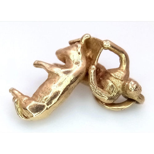 459 - A 9K YELLOW GOLD BULL AND BULL FIGHTER CHARM. TOTAL WEIGHT 2G