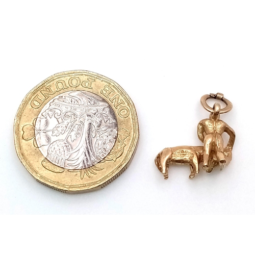 459 - A 9K YELLOW GOLD BULL AND BULL FIGHTER CHARM. TOTAL WEIGHT 2G