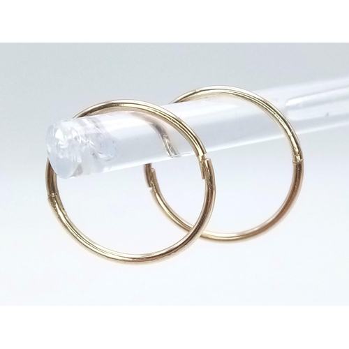 480 - A PAIR OF 9K YELLOW GOLD MINI SLEEPER HOOP EARRINGS. TOTAL WEIGHT 0.8G