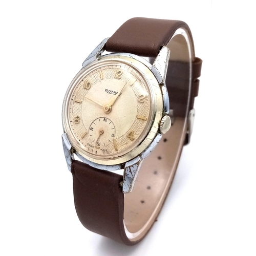 1039 - A Vintage Rotary Mechanical Gents Watch. Brown leather strap. Stainless steel case - 33mm. Cream dia... 