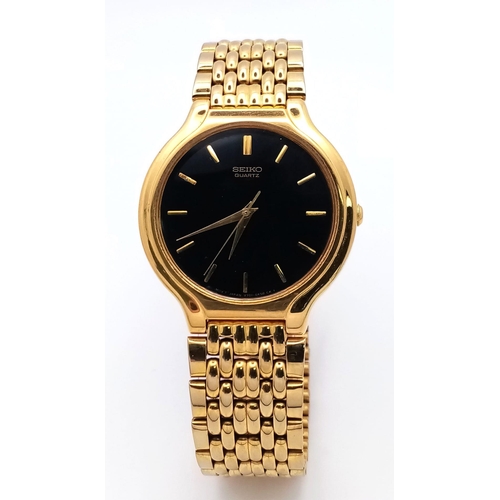 1068 - A Vintage Seiko Quartz Gold Plated Gents Dress Watch. Gold plated bracelet and case - 34mm. Black di... 