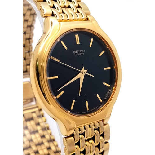 1068 - A Vintage Seiko Quartz Gold Plated Gents Dress Watch. Gold plated bracelet and case - 34mm. Black di... 