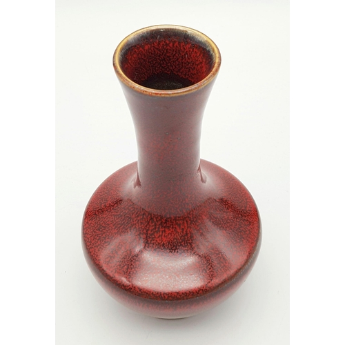 122 - A Chinese Iron-Rust Glazed Bottle Vase. Covered all over in a reddish-brown glaze speckled with irid... 