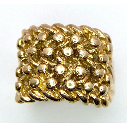 277 - A 9K GOLD KEEPER RING . 9.2gms   size S