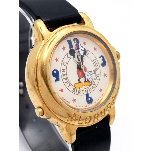 635 - A Lorus Mickey Mouse Happy Birthday Quartz Watch. Black leather strap. Gilded case - 33mm. Mickey Mo... 