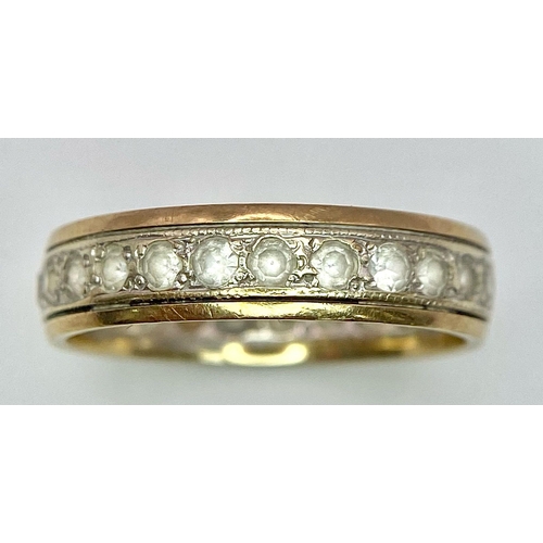 1055 - A 9 K yellow gold, stone set, eternity ring. One stone missing. Size: O, weight: 2.7 g.