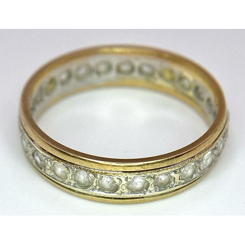 1055 - A 9 K yellow gold, stone set, eternity ring. One stone missing. Size: O, weight: 2.7 g.