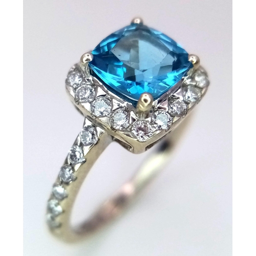 1014 - A 9K WHITE GOLD DIAMOND & LONDON BLUE TOPAZ RING. TOTAL WEIGHT 2.1G. SIZE I