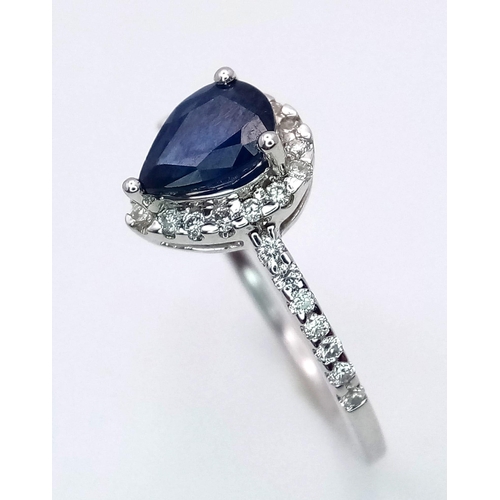 1018 - 18K WHITE GOLD DIAMOND & SAPPHIRE  RING, WITH A  PEAR SHAPED SAPPHIRE CENTRE AND SURROUNDED BY DIAMO... 