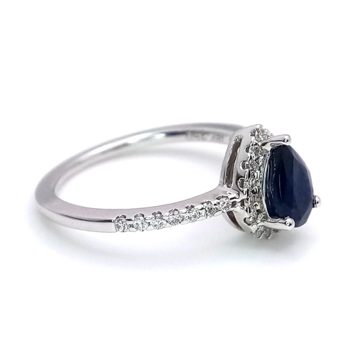 1018 - 18K WHITE GOLD DIAMOND & SAPPHIRE  RING, WITH A  PEAR SHAPED SAPPHIRE CENTRE AND SURROUNDED BY DIAMO... 