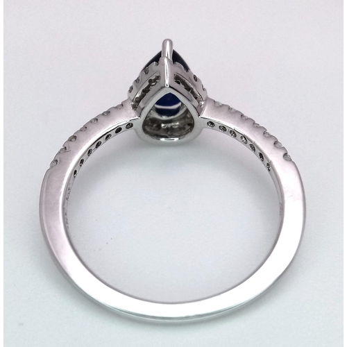 1018 - 18K WHITE GOLD DIAMOND & SAPPHIRE  RING, WITH A  PEAR SHAPED SAPPHIRE CENTRE AND SURROUNDED BY DIAMO... 