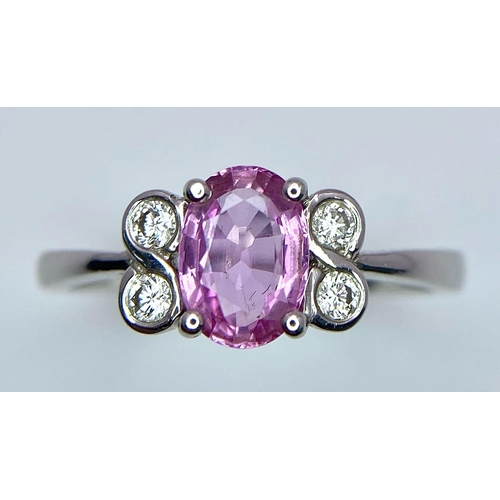 1025 - 18K WHITE GOLD DIAMOND & PINK SAPPHIRE RING, WITH CENTRE OVAL SAPPHIRE AND FLANKED BY 4 ROUND BRILLI... 