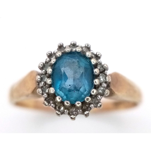 1175 - A PRETTY 9K GOLD RING WITH AQUAMARINE CENTRE STONE SURROUNDED BY SMALL DIAMONDS .   3.2gms   size Q