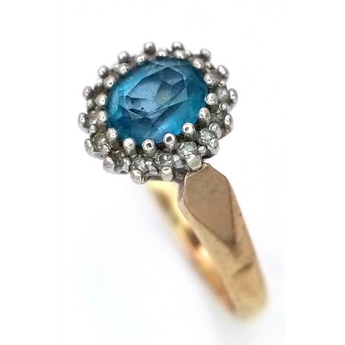 1175 - A PRETTY 9K GOLD RING WITH AQUAMARINE CENTRE STONE SURROUNDED BY SMALL DIAMONDS .   3.2gms   size Q