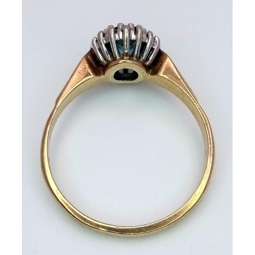 1175 - A PRETTY 9K GOLD RING WITH AQUAMARINE CENTRE STONE SURROUNDED BY SMALL DIAMONDS .   3.2gms   size Q