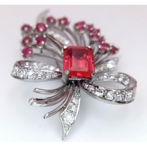 327 - A STUNNING DIAMOND AND RUBY BROOCH SET IN PLATINUM , A MAJESTIC SPRAY OF RUBIES EMINATING FROM A DIA... 