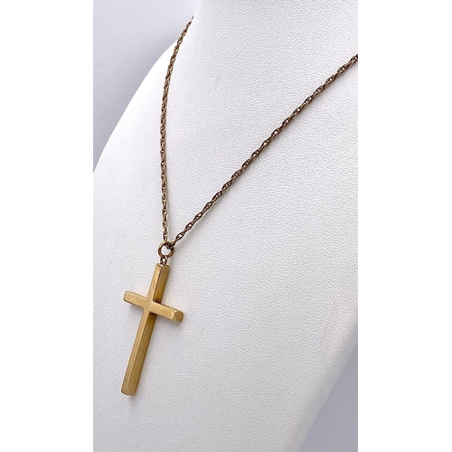 625 - A 9K GOLD CROSS PENDANT ON A 72cms 9K GOLD TWIST CHAIN .   10.8gms