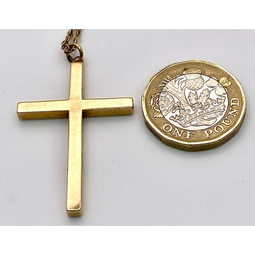 625 - A 9K GOLD CROSS PENDANT ON A 72cms 9K GOLD TWIST CHAIN .   10.8gms