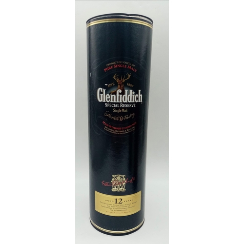 771 - Two Large Bottles of Famous Brand Whisky: A one litre boxed bottle of 12 year old Glenfiddich and a ... 