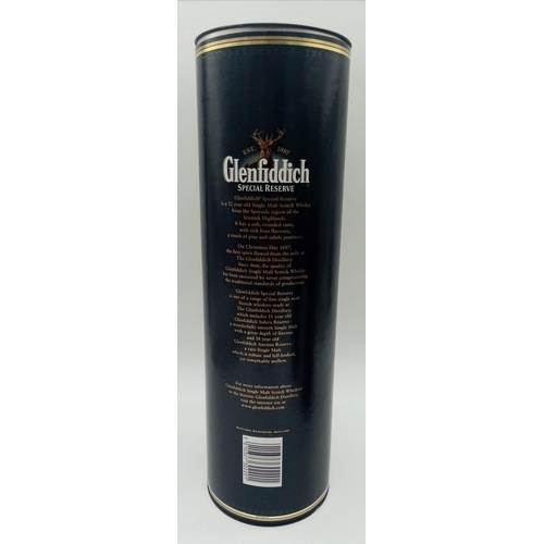 771 - Two Large Bottles of Famous Brand Whisky: A one litre boxed bottle of 12 year old Glenfiddich and a ... 