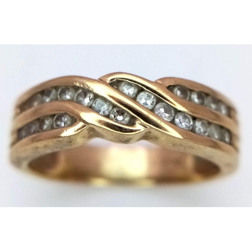 824 - A 9K YELLOW GOLD 0.25CT DIAMOND 2 ROW BAND RING. TOTAL WEIGHT 3.2G. SIZE K