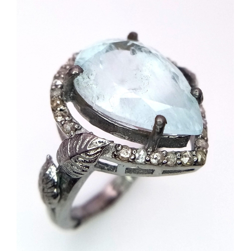 1132 - An Aquamarine and Diamond 925 Silver Ring. Central 8ct pear-shaped aquamarine with 0.50ctw of diamon... 