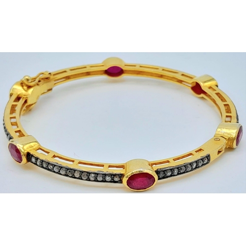 1160 - A Ruby and Diamond Bracelet set in Gold Plated 925 Silver. Six oval cut rubies with multi diamond sp... 