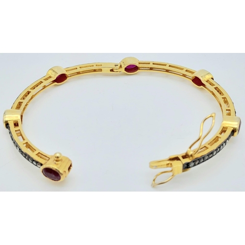 1160 - A Ruby and Diamond Bracelet set in Gold Plated 925 Silver. Six oval cut rubies with multi diamond sp... 