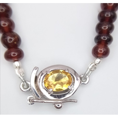 1167 - A 250ctw Garnet Rondelle Gemstone Necklace with Citrine Clasp set in 925 Silver. 42cm length. 49.3g ... 