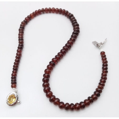 1167 - A 250ctw Garnet Rondelle Gemstone Necklace with Citrine Clasp set in 925 Silver. 42cm length. 49.3g ... 