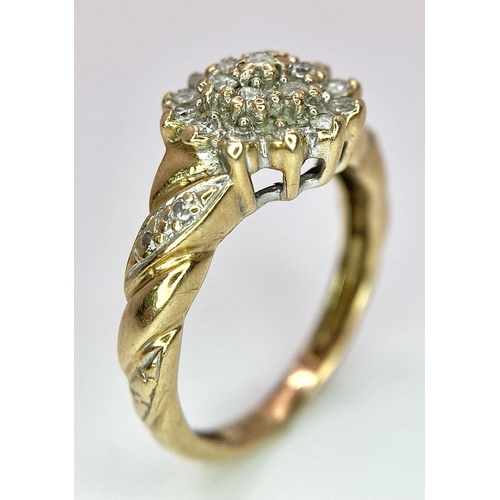 1042 - A 9K YELLOW GOLD 0.25CT  DIAMOND CLUSTER RING. TOTAL WEIGHT 2.2G. SIZE J