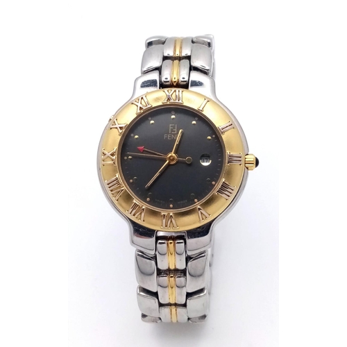 1076 - A Ladies Fendi Two-Tone Quartz Watch. Two-tone bracelet and case - 32mm. Black dial with date window... 