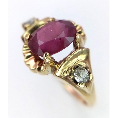 1150 - AN 18K GOLD OVAL RUBY AND 2 DIAMOND RING .   3.5gms   size N