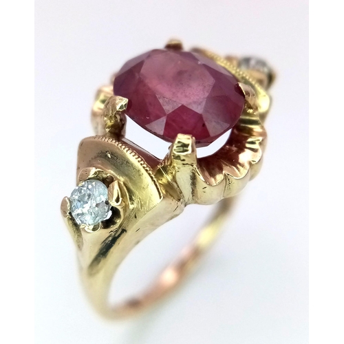 1150 - AN 18K GOLD OVAL RUBY AND 2 DIAMOND RING .   3.5gms   size N