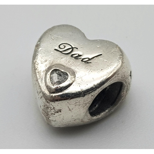 1156 - A PANDORA STERLING SILVER HEART SHAPED STONE SET CHARM, ENGRAVED WITH THE WORD 