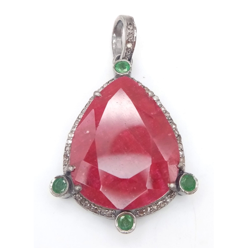 652 - A 21ct Ruby Gemstone Pendant with 0.60ctw of Diamond and 0.50ctw Emerald accents. Set in 925 Silver.... 