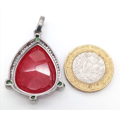 652 - A 21ct Ruby Gemstone Pendant with 0.60ctw of Diamond and 0.50ctw Emerald accents. Set in 925 Silver.... 